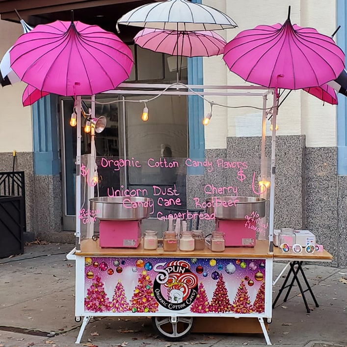 cotton candy cart with christmas themed sign